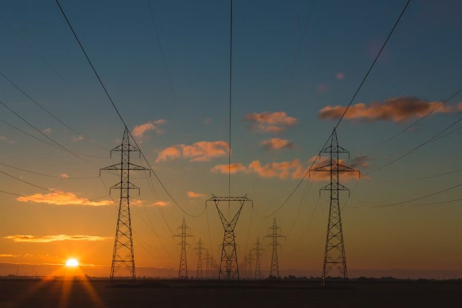 High-voltage transmission lines at dusk
